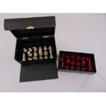 A Staunton style chess set, natural and red stained pieces in fitted leather case by Aspreys of