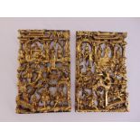 A pair of gilded wooden Chinese wall plaques depicting figures, buildings, trees and foliage, 48 x