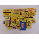 A quantity of Matchbox diecast to include trucks, transporters, farm equipment, diggers and a fire