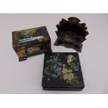 A Victorian papier-mâché tea caddy, letter rack and box with cover all decorated with floral