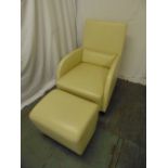 A cream leather occasional chair and matching footstool by Ligne Roset