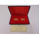 A cased set of two gold replica Winston Churchill stamps set in 18ct gold, to include COA, approx
