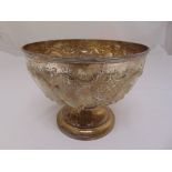 A late Victorian Mappin and Webb silver punch bowl with scroll and florally chased sides on raised