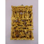 A Chinese gilded wooden wall plaque depicting figures, animals, buildings and vegetation, 47 x 30cm