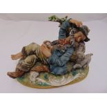 Capodimonte figurine of a Sleeping Man of The Road signed to the base, to include COA, 17.5cm (h)