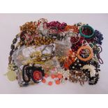 A quantity of costume jewellery to include necklaces, bracelets, brooches and earrings