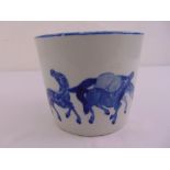 A Chinese blue and white jardinière of tapering cylindrical form, the sides decorated with horses,
