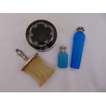 Two blue glass scent bottles with silver repousse tops, largest 13cm long, a silver handled crumb
