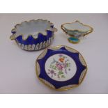 A quantity of Limoges hand painted porcelain to include a twin handled vase, a cache pot, and a blue