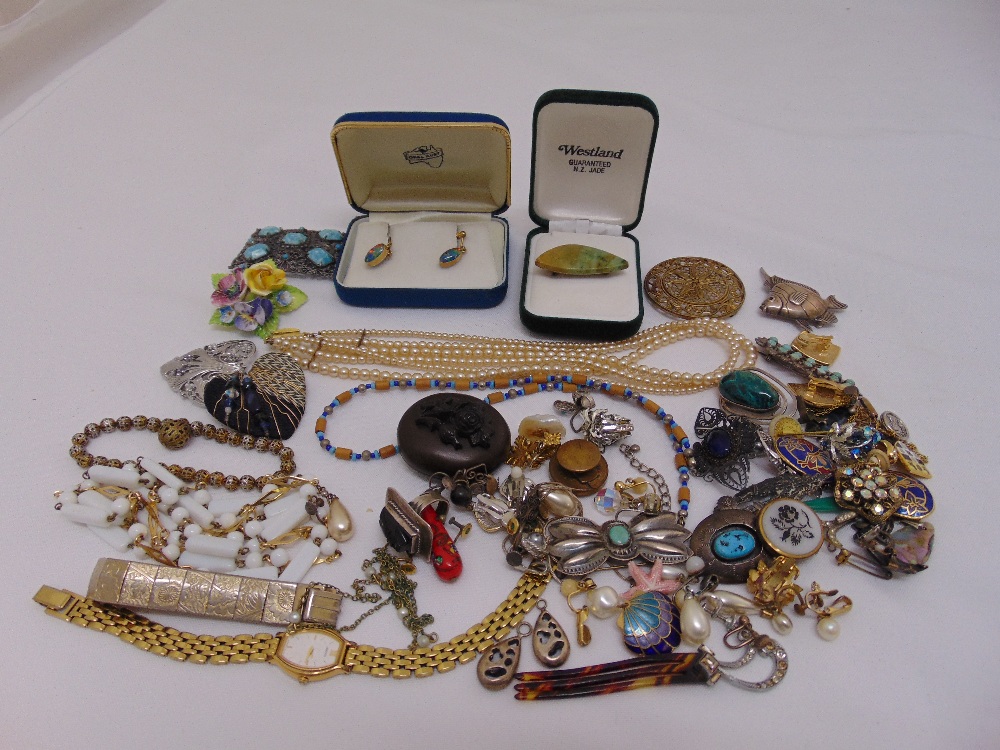 A quantity of costume jewellery to include necklaces, brooches, earrings and a watch