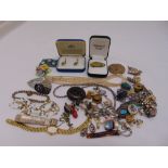 A quantity of costume jewellery to include necklaces, brooches, earrings and a watch