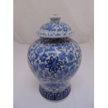 A Chinese blue and white baluster vase and cover decorated with flowers and leaves, 42cn (h)