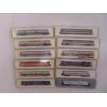 Marklin Z gauge eight coaches, a car transporter and tow wagons all in original packaging (12)