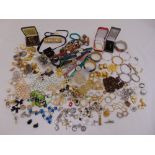 A quantity of costume jewellery to include necklaces, brooches, earrings, bracelets, rings and