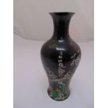 A Chinese black ground baluster vase decorated with birds, flowers and leaves, 28cm (h)