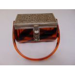 A Lucite and silver plated 1940s ladies handbag, rounded rectangular with swing handle