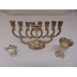 A quantity of silver and white metal to include a Kiddush cup, a Menorah and a cigar lighter, all