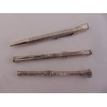 Three silver cased propelling pencils