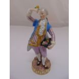 Meissen 19th century figurine of a boy in classical dress holding flowers C73, marks to the base,