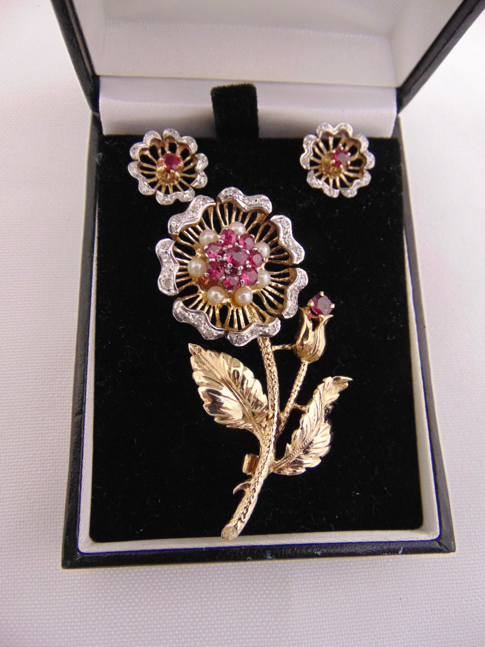 9ct yellow gold flower brooch set with diamond, rubies and pearls and a pair of matching earrings,