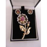 9ct yellow gold flower brooch set with diamond, rubies and pearls and a pair of matching earrings,
