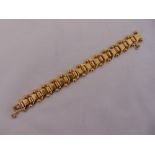 Portuguese 19.2ct yellow gold fancy link bracelet with safety chain, length 19cm, approx weight 50.