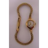 9ct yellow gold Betina Star ladies wristwatch on a 9ct gold articulated bracelet, approx total