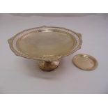 A silver cake stand, circular pierced sides with shell, leaf and gadrooned border on trumpet foot,