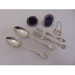 A quantity of silver to include Georgian spoons and forks, a wine label and two miniature photograph