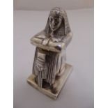 A Victorian silver novelty match holder in the form of an Egyptian pharaoh with hinged cover, gilt