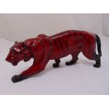 Royal Doulton flambé tiger of customary form, 16cm (h) 34cm (w)