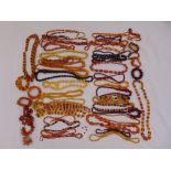 A quantity of necklaces and bracelets to include Amber of varying shape and form together with