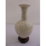 A Chinese Ge type crackle glaze baluster vase on pierced hardwood stand