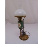A porcelain and brass table lamp with detachable glass dome