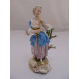 Meissen 19th century figurine Shepherdess playing a flute, slight loss to foliage and base of flute,