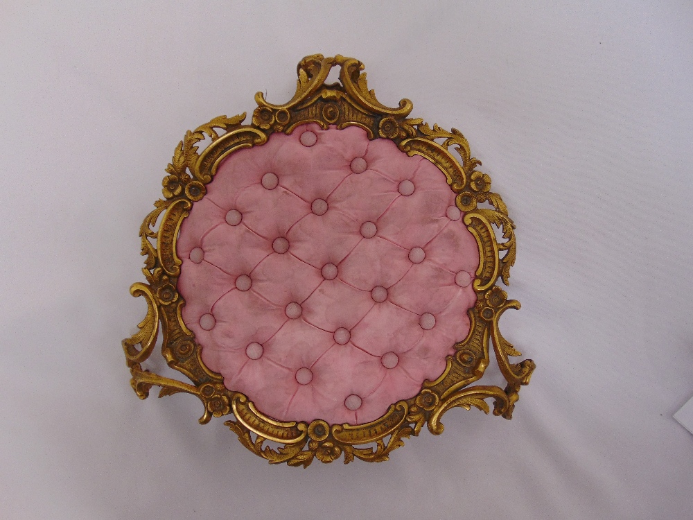 A French late 19th century ormolu ladies boudoir foot stool with pink button back central