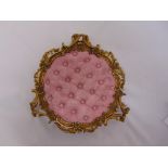 A French late 19th century ormolu ladies boudoir foot stool with pink button back central