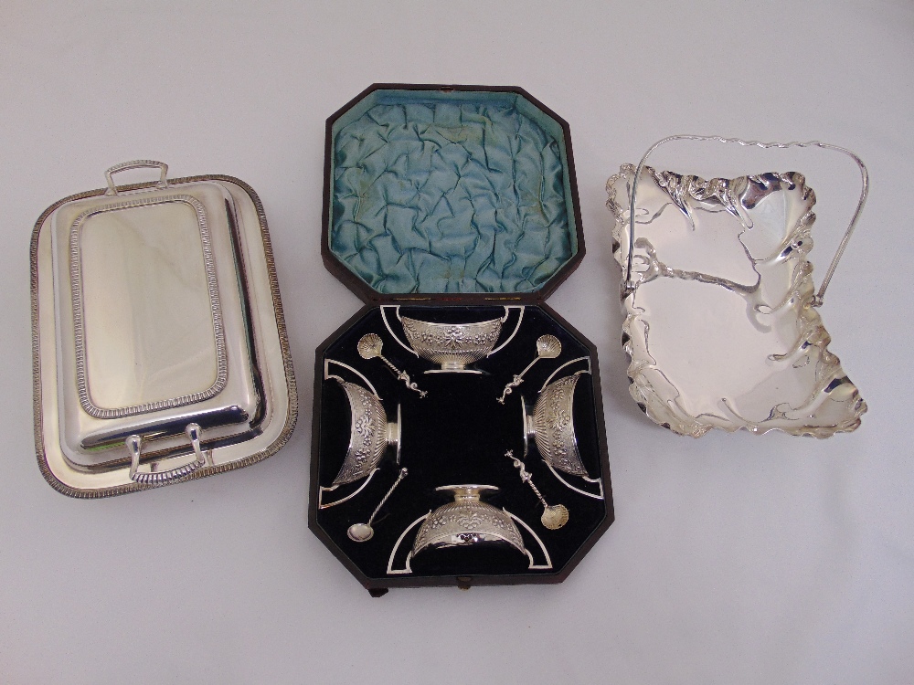 A cased set of four silver plated twin handled salts with silver hallmarked spoons, a silver