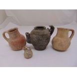 Three antique earthenware and terracotta jugs and pots from archaeological excavation