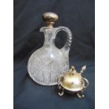 A cut glass ewer with hallmarked silver drop stopper and a silver globular form cigar lamp A/F