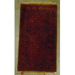 Two Persian rugs, red ground with repeating motif patterns and borders A.140 x 80cm B.144 x 106cm