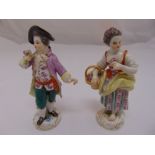 Two Meissen figurines of a boy and girl holding flowers, marks to the bases, 13cm (h)