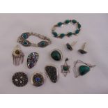 A quantity of white metal jewellery to include bracelets, cufflinks, pendants and brooches (11)
