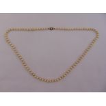 A cultured pearl single strand necklace with 9ct gold and pearl clasp