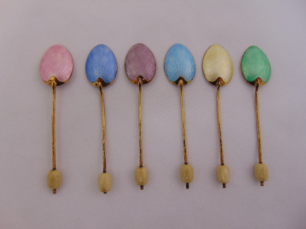 Six silver gilt and vari-coloured enamel teaspoons