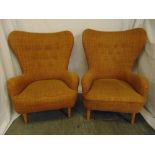 A pair of Ernest Race mid 20th century DA upholstered armchairs, metal base on four tubular beech