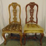 A pair of continental mahogany hall chairs with upholstered seats and cabriole legs