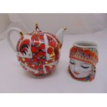 A Russian Imperial porcelain decorative teapot and a Russian porcelain character jug, circa 1970