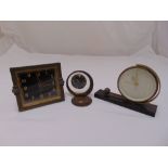 Three mid 20th century desk clocks of various style and form