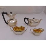 A silver four piece tea and coffee set, shaped rectangular with incuse sides, Birmingham 1926,